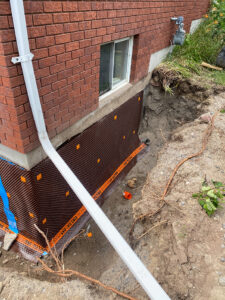Exterior basement foundation waterproofing wrap