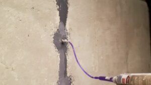 Basement crack repair by injection