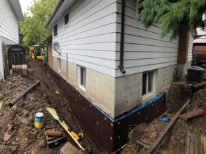 Basement foundation exterior wrap - Step 6: Outer waterproof membrane installed