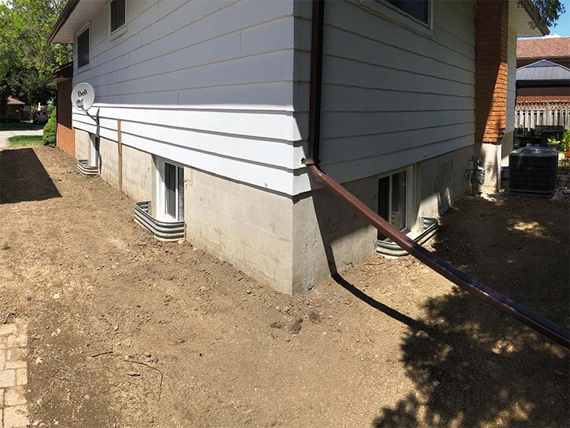 Completed outside foundation basement waterproofing